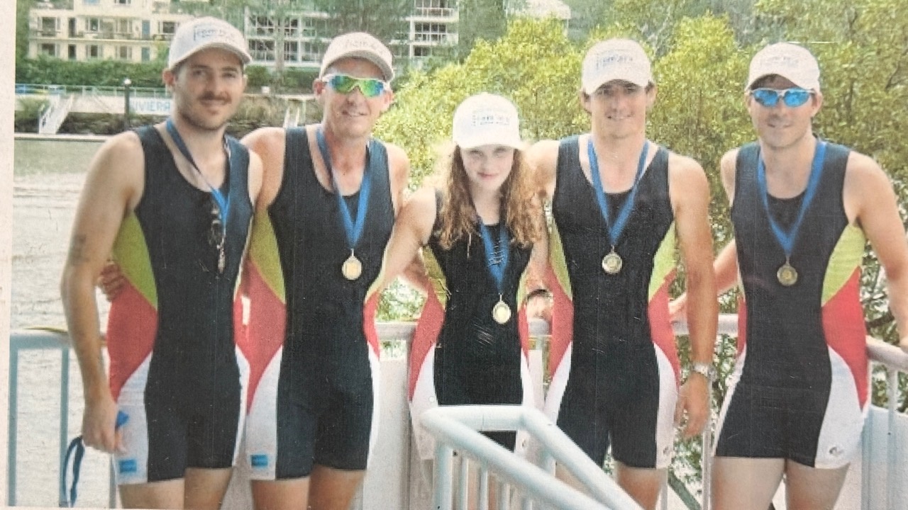 Omnia Diamonds rowing team wearing medals