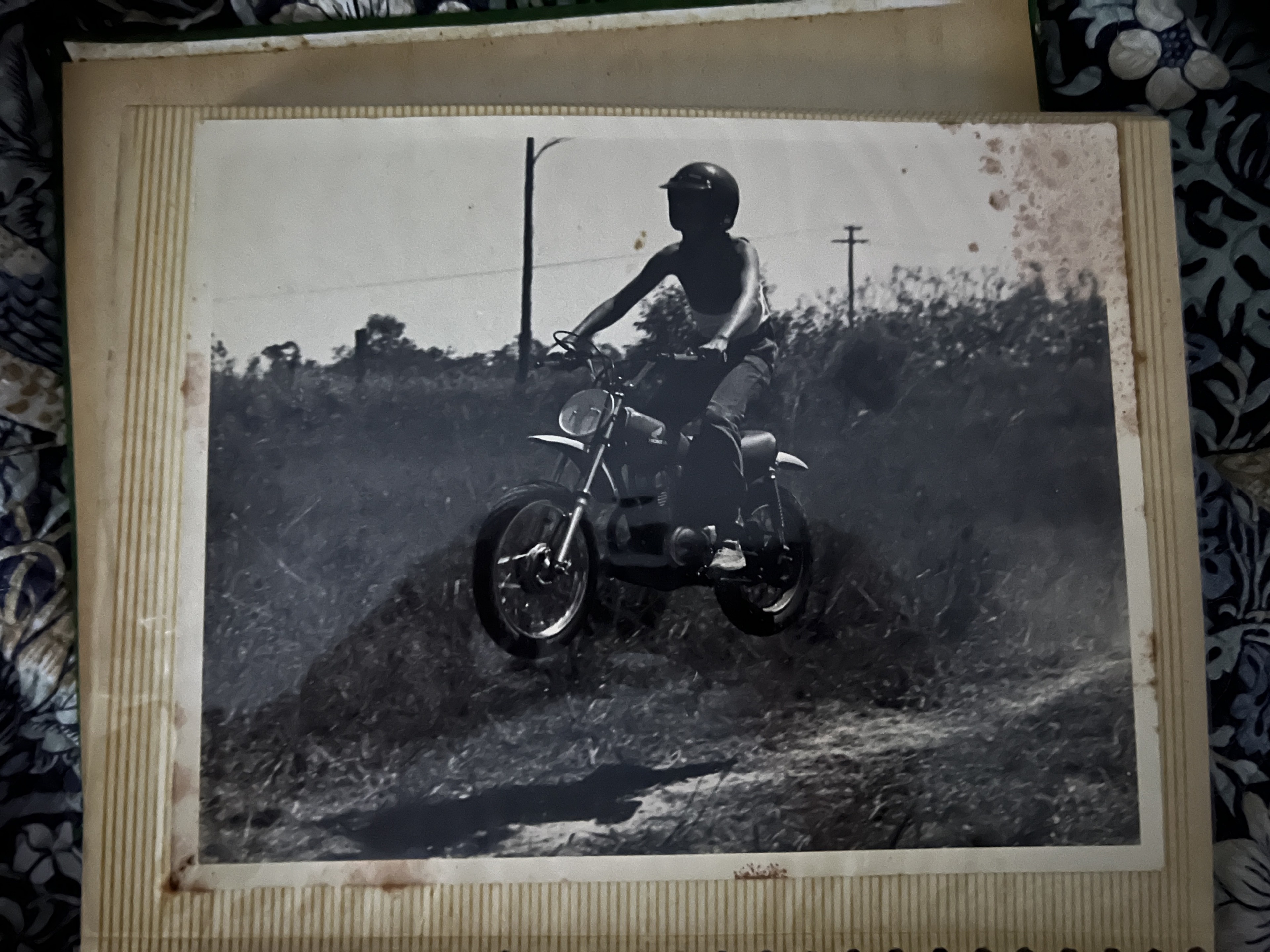 Black-and-white archive photograph of Scott van Iperen with a motorcycle