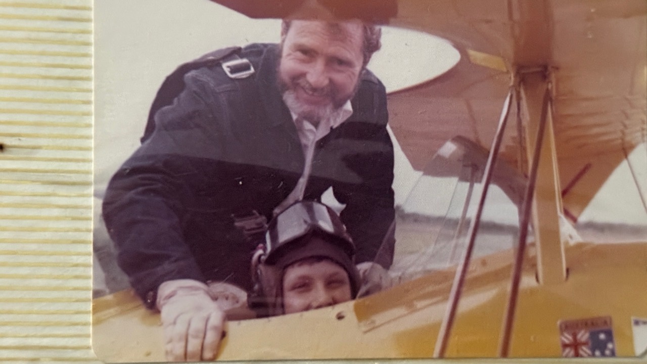 Scott van Iperen seated in the front cockpit of a Pitts S-2 aerobatic aircraft
